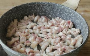 Render the Fat Heat your wok or pot over high heat and add a very small amount of oil. Add the pork strips and stir-fry for a few minutes.