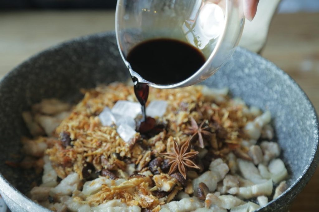 Create the Braising Liquid In a small bowl, mix the Huadiao wine (or Shaoxing wine), light soy sauce, and dark soy sauce. Pour this mixture into the pot. Stir well to coat the meat. Next, pour in about 400ml (1 ¾ cups) of warm water. The water should just barely cover the ingredients. Bring everything to a rolling boil over high heat.