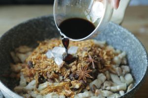Create the Braising Liquid In a small bowl, mix the Huadiao wine (or Shaoxing wine), light soy sauce, and dark soy sauce. Pour this mixture into the pot. Stir well to coat the meat. Next, pour in about 400ml (1 ¾ cups) of warm water. The water should just barely cover the ingredients. Bring everything to a rolling boil over high heat.
