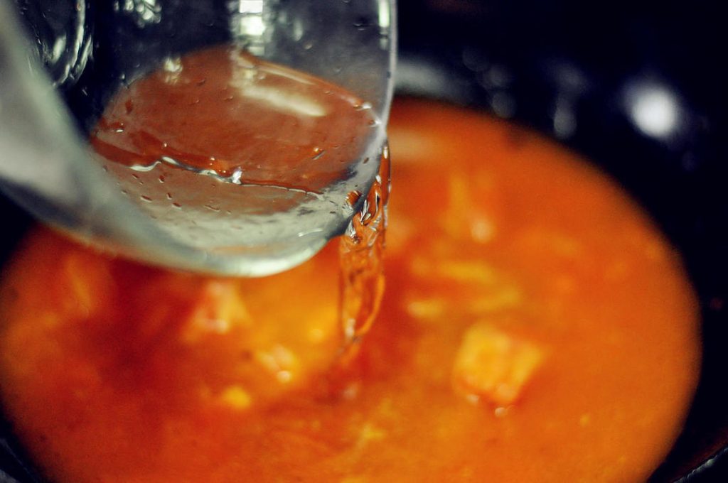 Build the Broth Pour in water (about 2-3 cups, enough to create a soup but not dilute the flavor). Season with Salt , Sugar , and Light Soy Sauce. Bring to a boil.