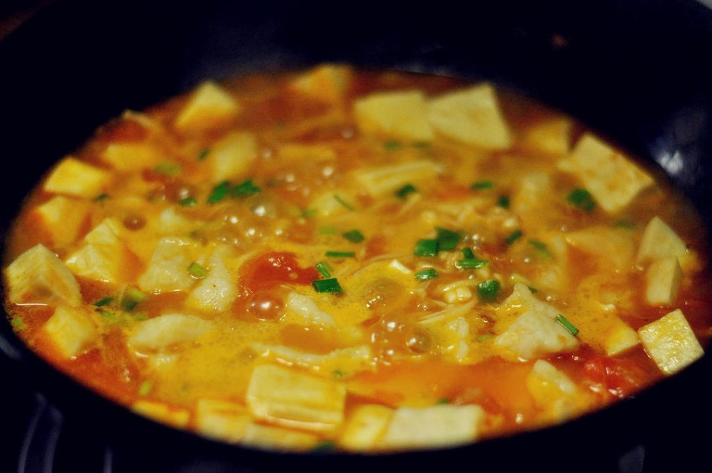Final Stewing Gently slide the blanched fish into the pot. Turn the heat down to low. Simmer for another 1-2 minutes to let the flavors meld. Be gentle when stirring to avoid breaking the tofu or fish.