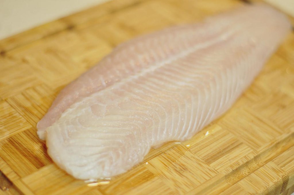 Blanch the Fish Bring a pot of water to a boil. Add the marinated fish pieces. Cook just until they turn opaque and white (about 30-45 seconds). Do not overcook. Immediately remove with a slotted spoon and set aside.