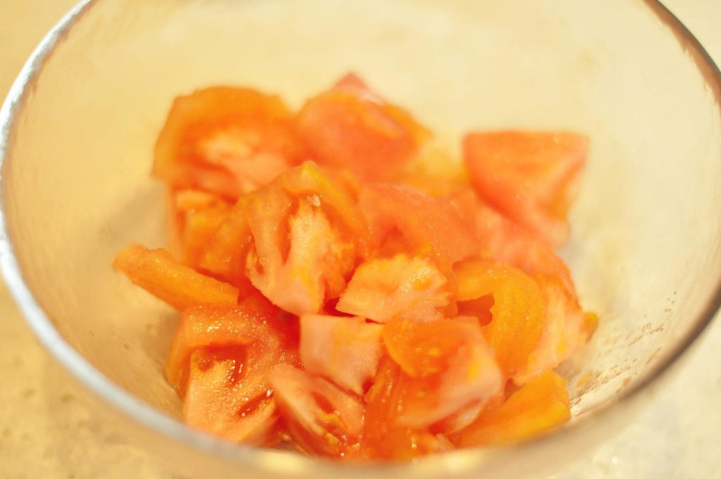 Create the Tomato Base Add the diced tomatoes to the pot. Stir-fry for 2-3 minutes until they break down and release their juices. Add the ketchup (approx. 1-2 tbsp) and stir to combine.