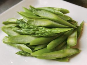 Asparagus Prep: Cut the asparagus on a bias (rolling cut) to expose more surface area. Snap off and discard the woody, tough ends.