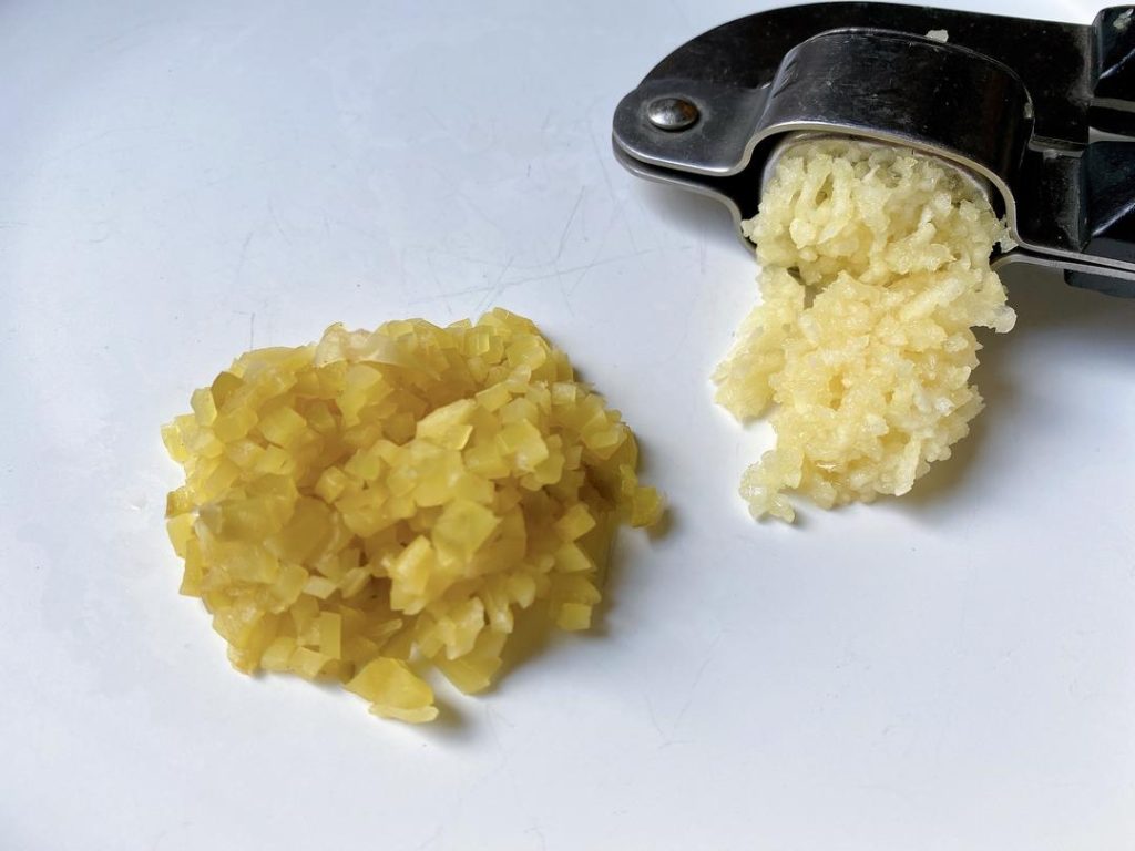 Chop the Toppings: Dice the century eggs and finely chop the Zha Cai. Press or mince your garlic.