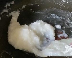Incorporate the Filling: Continue stirring the flour mixture over low heat until it forms a thick, translucent paste. Pour the reserved sesame and walnut mixture directly into the saucepan.