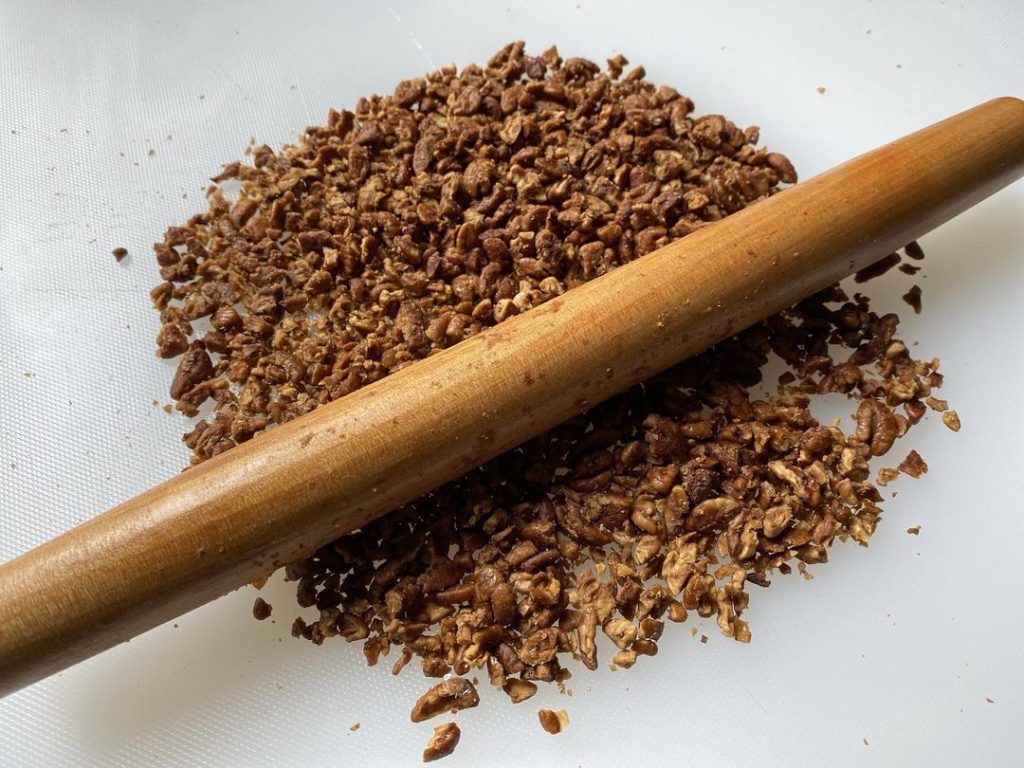 Crush the Walnuts: Place the roasted walnuts in a heavy-duty ziplock bag and crush them gently with a rolling pin. Do not use a food processor for this step; blending them will turn the nuts into fine dust, and you will lose the signature textural contrast of the filling.