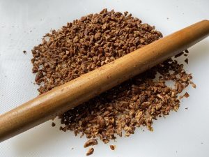 Crush the Walnuts: Place the roasted walnuts in a heavy-duty ziplock bag and crush them gently with a rolling pin. Do not use a food processor for this step; blending them will turn the nuts into fine dust, and you will lose the signature textural contrast of the filling.