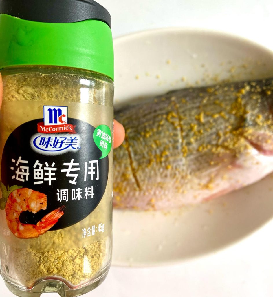 Marinate: Rub the seafood seasoning evenly all over the fish, making sure to get it inside the scored cuts and the cavity. Let it marinate for 30 minutes.