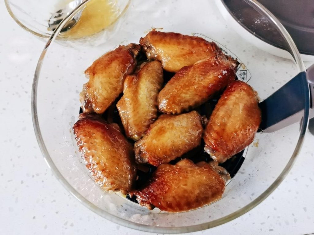The Honey Glaze: With 5 minutes remaining, pull the basket out and brush each wing generously with honey.