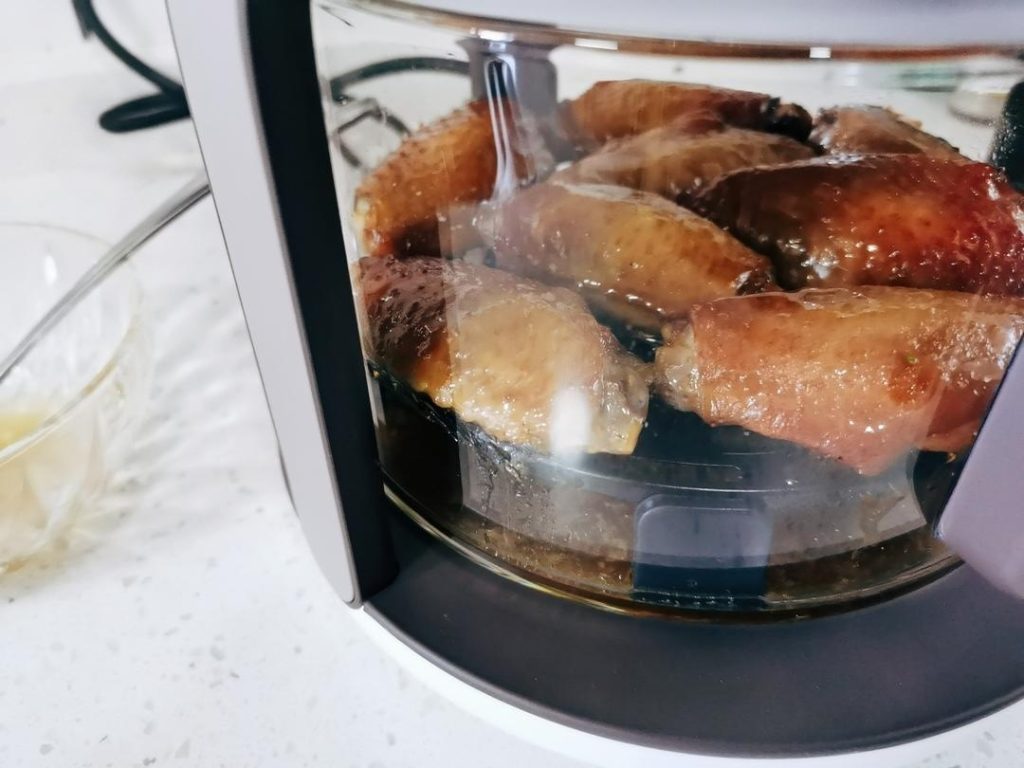 The Honey Glaze: With 5 minutes remaining, pull the basket out and brush each wing generously with honey.