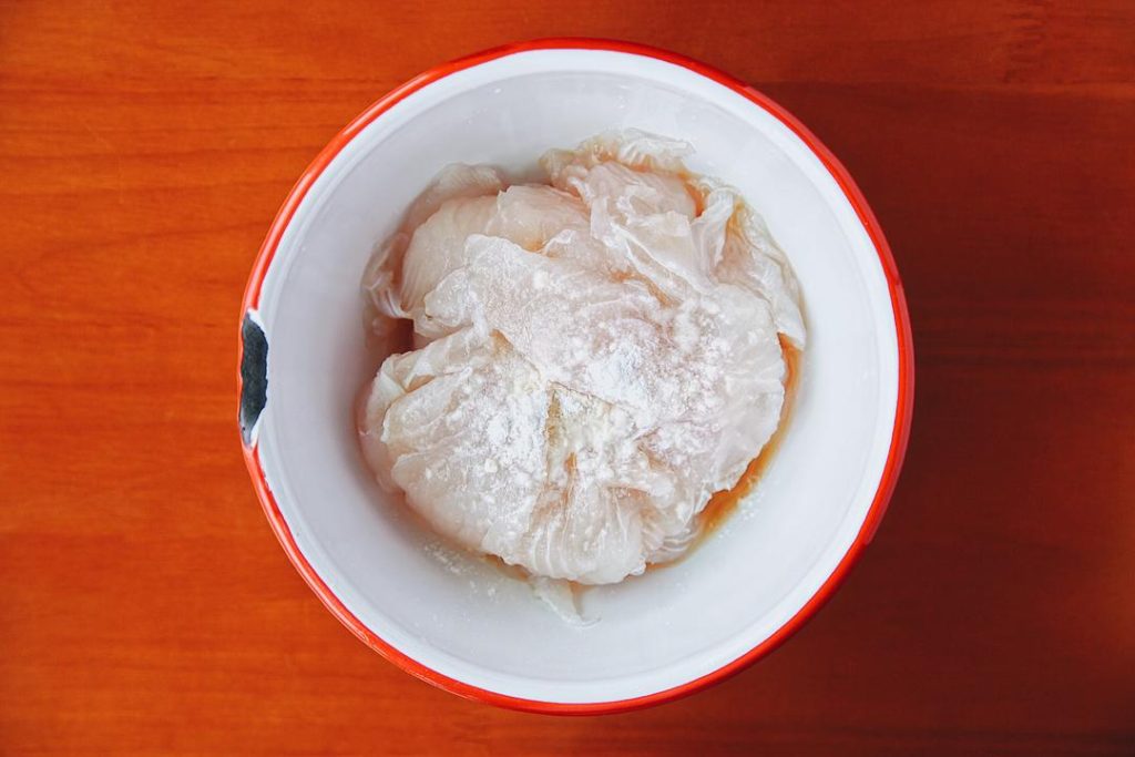 Slice the Fish AND Velveting: Mix the fish with Shaoxing wine, cornstarch, and salt.