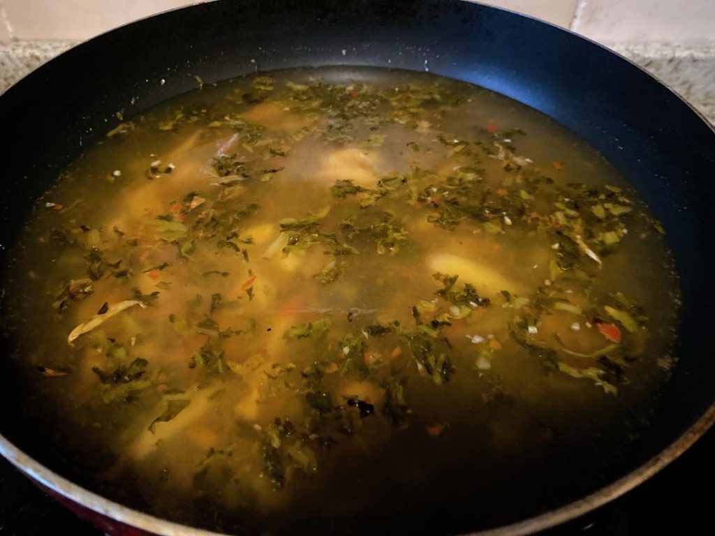 Build the Soup: Pour in the pork bone broth and water. Bring to a rolling boil. Season the broth with 1 tablespoon each of Shaoxing wine, soy sauce, oyster sauce, salt, and sugar.