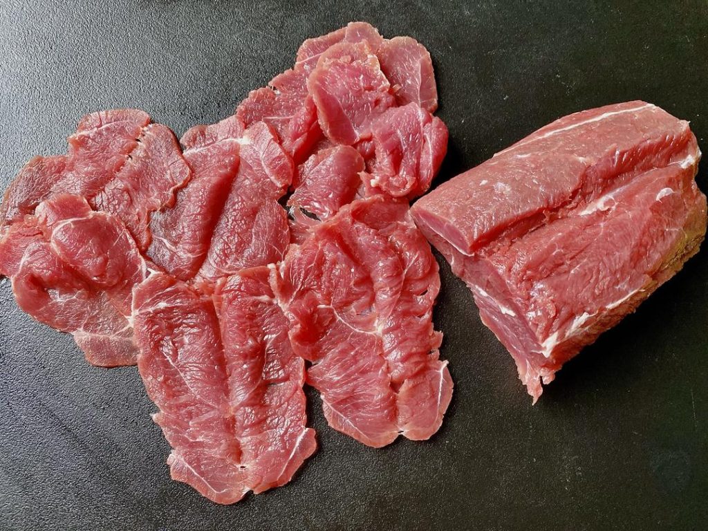 This firms up the meat without freezing it solid, allowing you to cut beautiful, even "butterfly" slices against the grain.