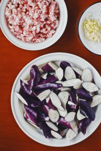 Cut the Eggplant: Slice the eggplant diagonally into "rolling" chunks (wedges).