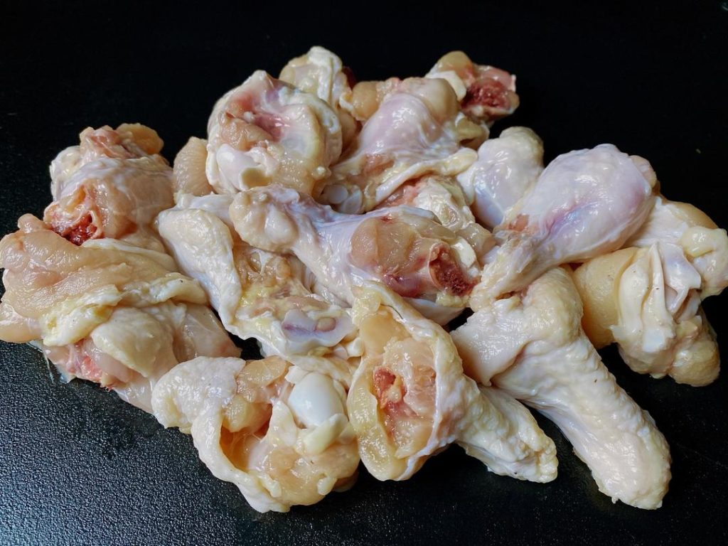 Prep the Chicken: Using a heavy cleaver, chop each chicken drumette in half. Keeping the bone in adds incredible flavor and gives you that authentic "picking" experience.