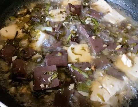 For Method 1: Heat 1 tbsp of oil in your wok over medium heat. Sauté the garlic and the white parts of the scallions (or chive stems) until fragrant. Toss in the pickled mustard greens and stir-fry for 30 seconds.