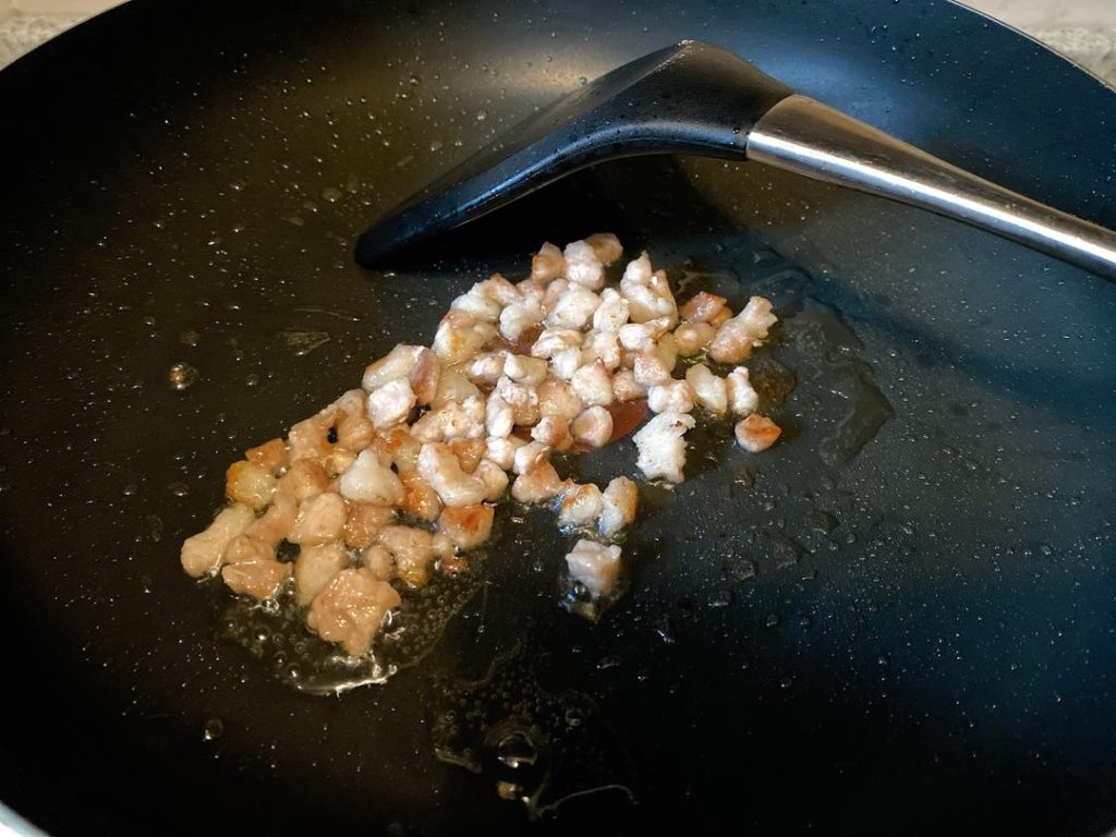 For Method 2: Heat 1 tbsp of oil over medium heat. Add the minced pork and stir-fry until the fat renders and it turns pale. Add the garlic and white scallion parts, frying until aromatic.