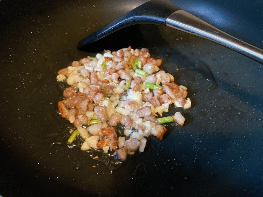 For Method 2: Heat 1 tbsp of oil over medium heat. Add the minced pork and stir-fry until the fat renders and it turns pale. Add the garlic and white scallion parts, frying until aromatic.