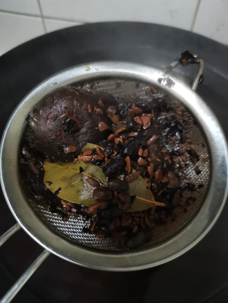 Strain and cool: Turn off the heat. Use a slotted spoon or spider to scoop out the large solids. Then, pass the liquid through a fine-mesh strainer lined with cheesecloth into a large bowl to catch all the gritty bits.