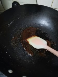 By melting the sugar in the dry pot, we are initiating caramelization (pyrolysis). The sugar breaks down into hundreds of new, complex flavor compounds that provide the signature dark color and slightly bitter, roasted depth characteristic of aged Light Soy Sauce.