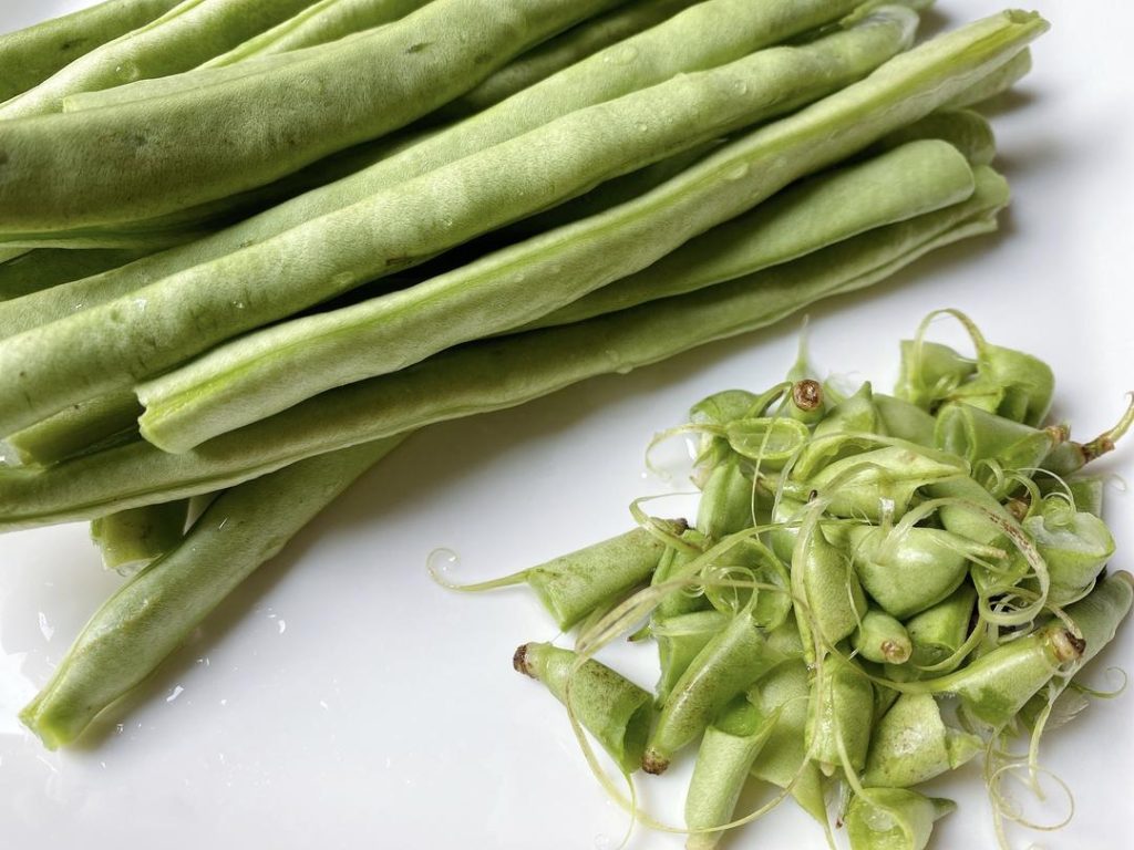 Clean the Beans: Trim the ends off the green beans and cut them into uniform 1/2-inch (1 cm) pieces. Uniformity ensures they cook at the same rate.