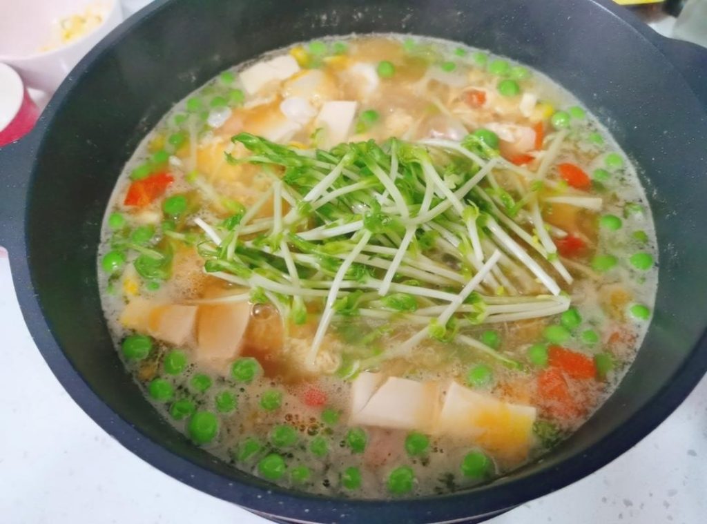 Final Touches: Turn off the heat. Stir in the white pepper and the fresh pea shoots. Taste for seasoning, and serve immediately!