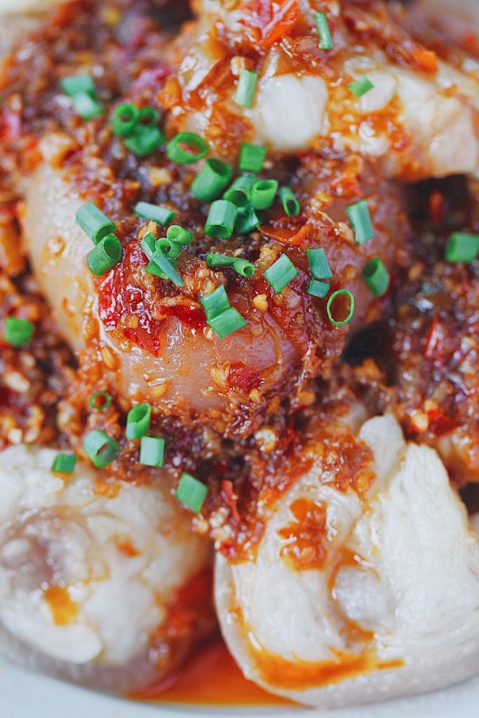 Serve: Pour the hot, fragrant sauce directly over the plated pork knuckle. Garnish with scallions and enjoy!