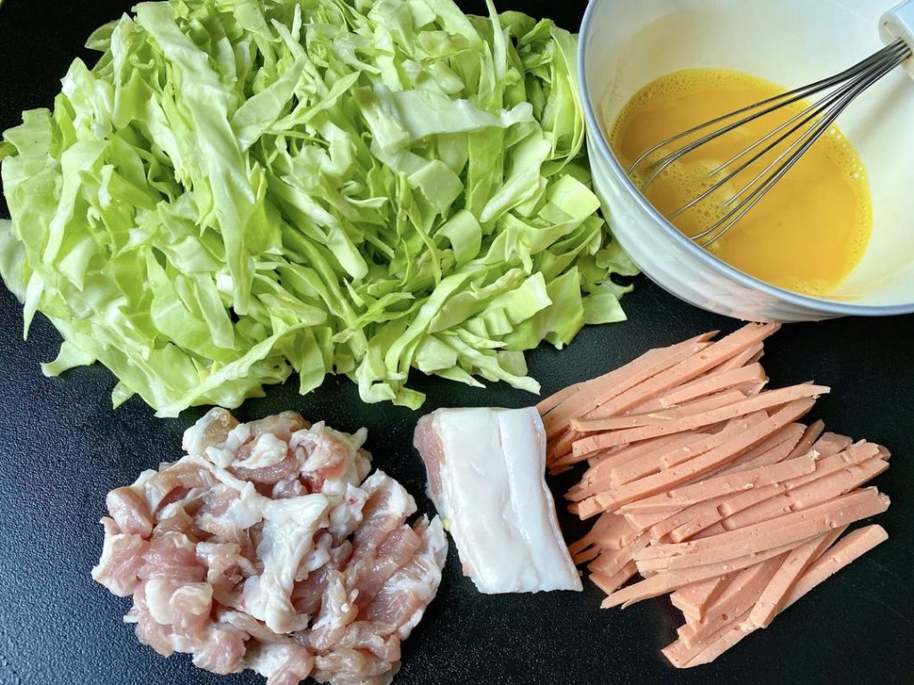 Julienne Everything: Cut your lean pork, cabbage, and ham into thin, uniform strips. This ensures everything cooks at the same rate and mixes evenly with the thin noodles.