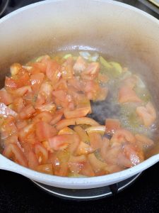 Break down the tomatoes (3-4 minutes, Medium-High Heat)