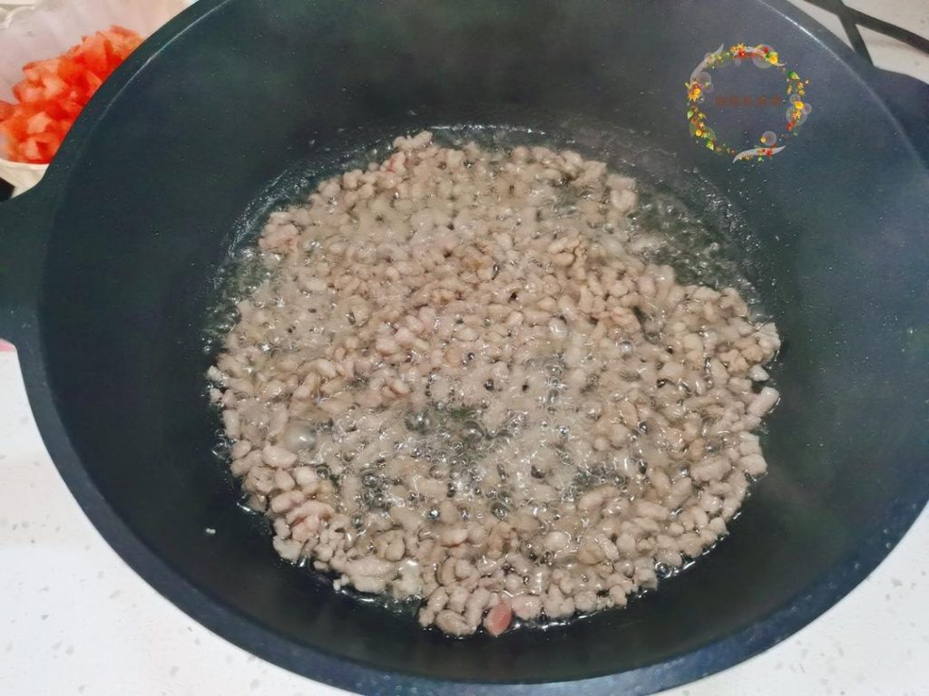 Sauté the Pork: Heat the sunflower oil in your wok over medium-high heat. Add the ground pork and stir-fry until it turns white and starts to crumble.