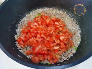 The Tomato Breakdown: Add the diced tomatoes. Lower the heat slightly and stir-fry until the tomatoes release their juices and form a pulpy base. This is similar to the base of a Tomato Egg Drop Soup.