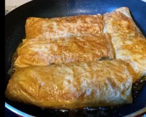 Braise: Pour the remaining braising liquid into the pan with the rolls. Add a splash of extra water if needed. Bring to a boil, then reduce the heat to low.