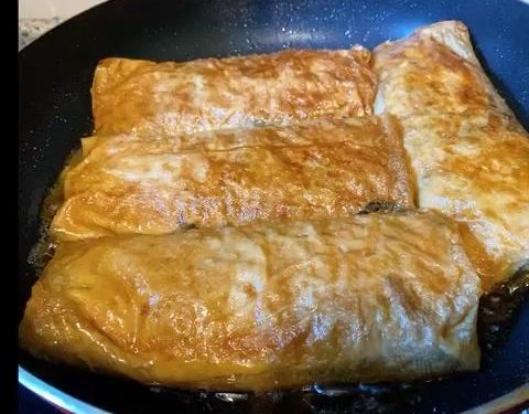 Braise: Pour the remaining braising liquid into the pan with the rolls. Add a splash of extra water if needed. Bring to a boil, then reduce the heat to low.