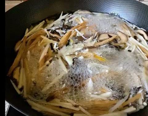 Blanch the Vegetables: Bring a pot of water to a boil. Add the julienned bamboo, wood ear, Zha Cai, shiitake, and enoki mushrooms. Blanch for 2 minutes. Remove, rinse immediately under cold water to stop the cooking process, and drain thoroughly.