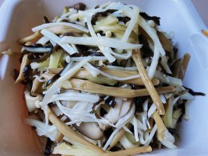 Blanch the Vegetables: Bring a pot of water to a boil. Add the julienned bamboo, wood ear, Zha Cai, shiitake, and enoki mushrooms. Blanch for 2 minutes. Remove, rinse immediately under cold water to stop the cooking process, and drain thoroughly.