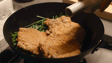 Construct the Bed: Lay the remaining scallion segments in the pan and place the pork chops directly on top.