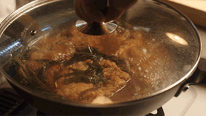 Simmer & Braise: Add 2 tbsp wine, 3 tbsp light soy, 2 tbsp dark soy, rock sugar, and enough water to reach the meat level. Cover and simmer on medium-low for 3 minutes.