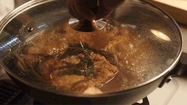 Simmer & Braise: Add 2 tbsp wine, 3 tbsp light soy, 2 tbsp dark soy, rock sugar, and enough water to reach the meat level. Cover and simmer on medium-low for 3 minutes.