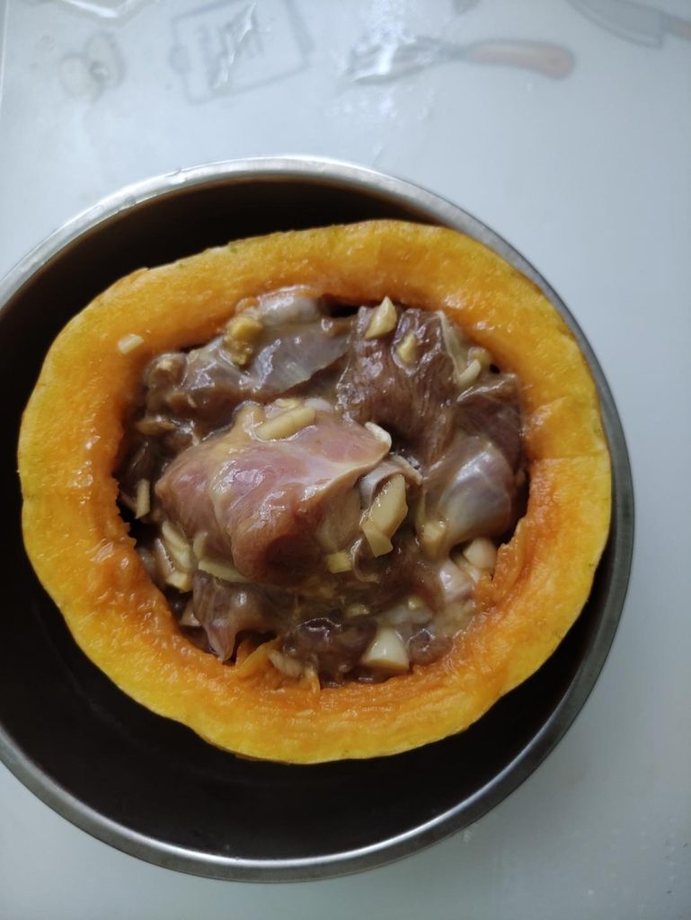 Filling: Pack the marinated duck into the pumpkin bowl. Don't overpack; leave a little space for the steam to circulate.