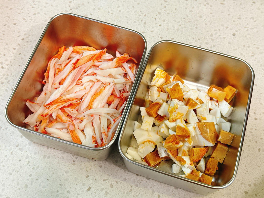 Dicing salted duck eggs and shredding crab sticks
