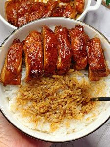 Mixing the teriyaki sauce with soy sauce honey and water