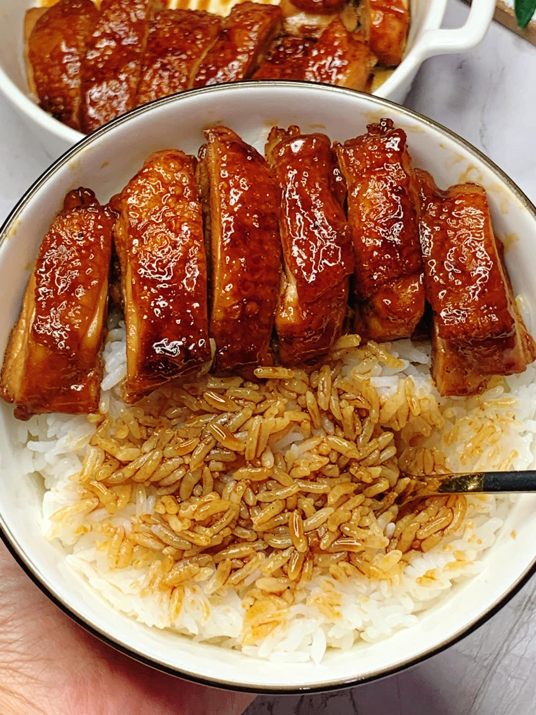 Mixing the teriyaki sauce with soy sauce honey and water