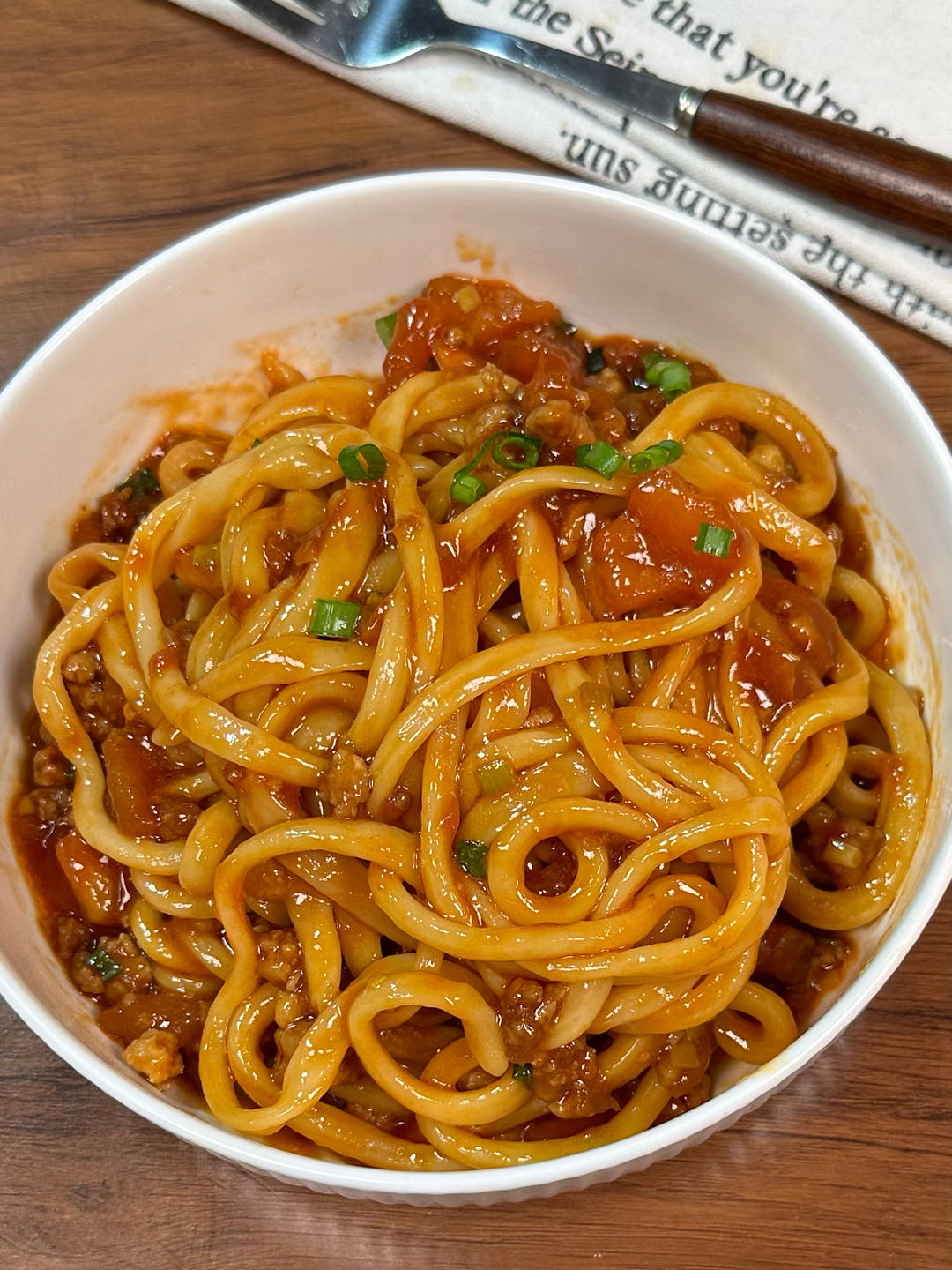 Tomato meat sauce noodles in a serving bowl