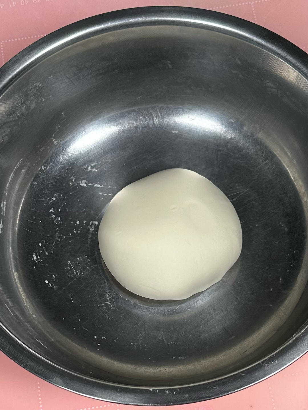 Kneading the dough into a smooth ball