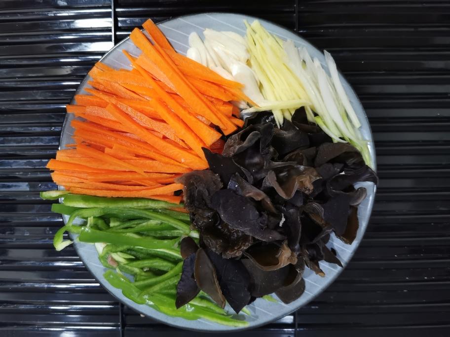 Preparing the yuxiang sauce with vinegar sugar and soy