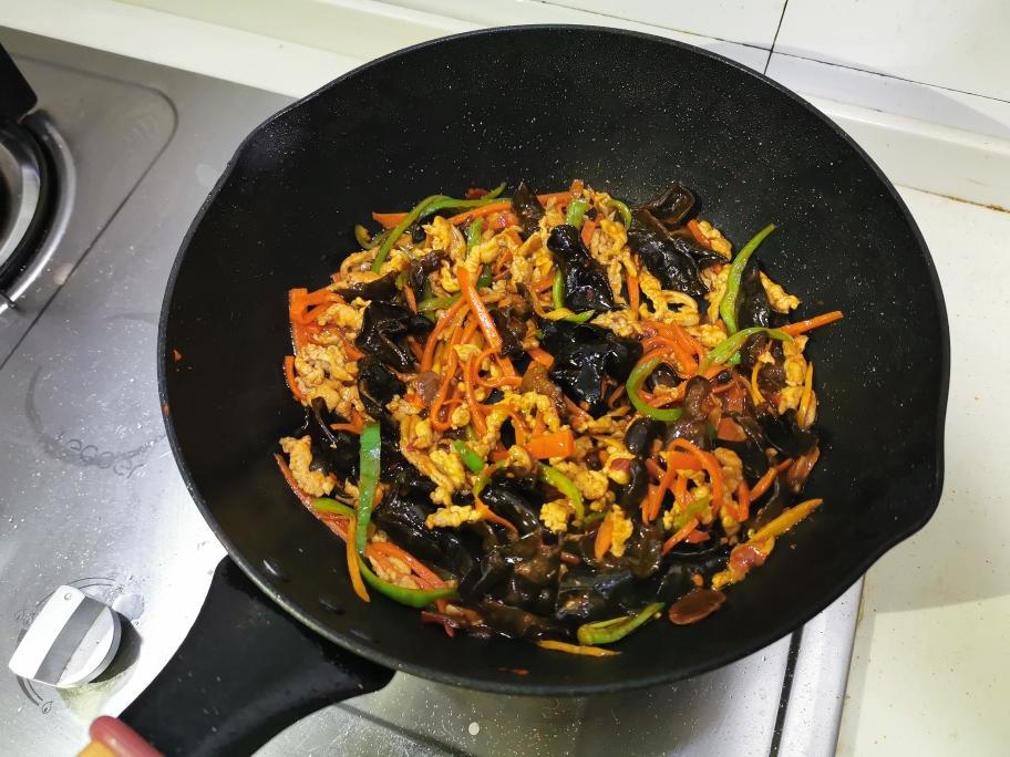 Stir-frying until the sauce thickens and coats everything
