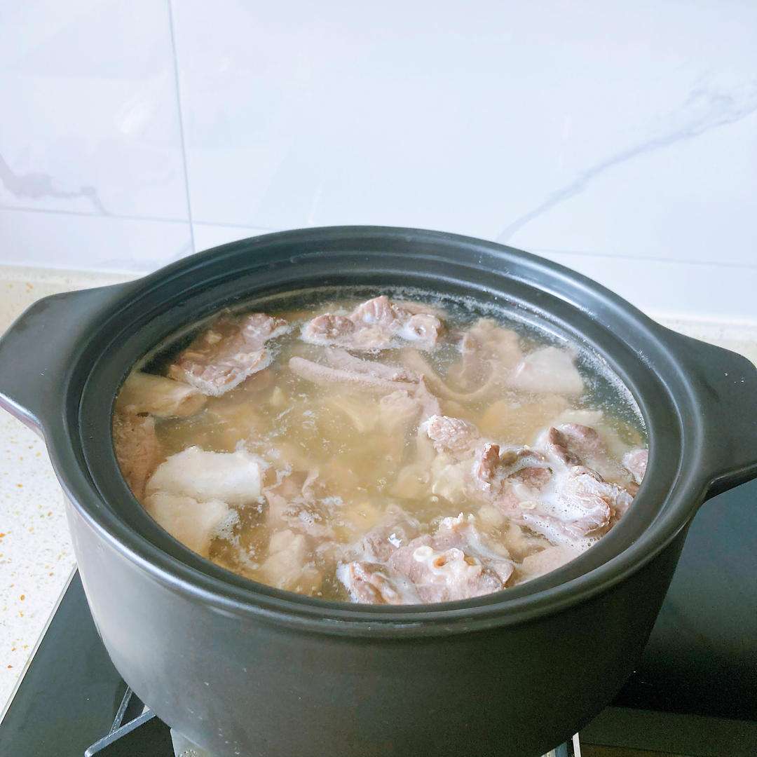 Skim the foam, cover, and poach the offal for 10 minutes over a gentle simmer.