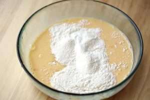 Add the cake flour and sugar and whisk until the batter is smooth with no lumps.
