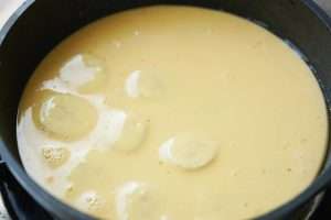 Pour the batter over the banana slices so it covers them evenly.